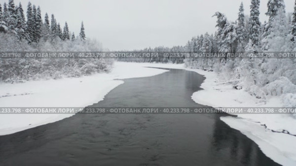 Aerial  flight above Amazing Wild River In Frozen Forest. Really Snowy Winter On The North. Стоковое видео, видеограф Кирилл Трифонов / Фотобанк Лори