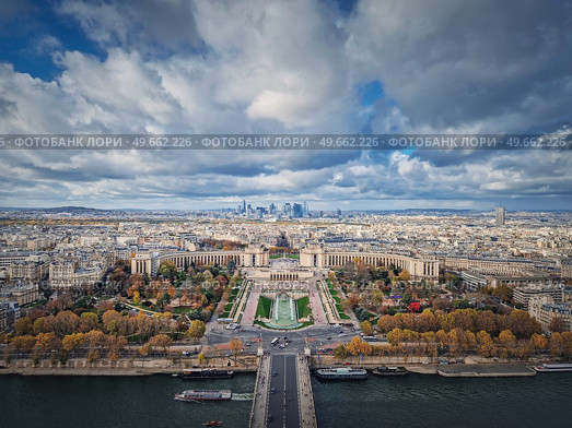 Aerial panoramic view from the Eiffel tower height to the Paris cityscape, France. Seine river, Trocadero area and La Defense metropolitan district seen on the horizon. Стоковое фото, агентство Ingram Publishing / Фотобанк Лори