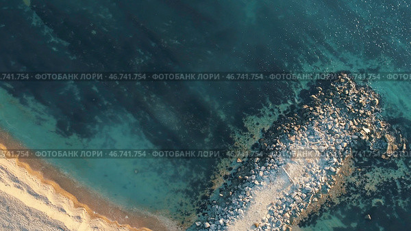 Aerial view of the rusty sunken ship stuck on a rocky shoal. Стоковое фото, фотограф David Kashakhi / Фотобанк Лори
