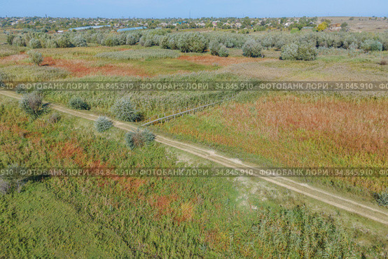Aerial view on wooden footbridge through the reeds over flood-meadow. Kartal Eco Park, Orlovka village, Reni raion, Odessa oblast, Ukraine, Eastern Europe (2020 год). Стоковое фото, фотограф Некрасов Андрей / Фотобанк Лори