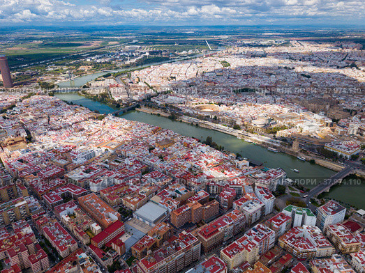 Aerial view Sevilla of city center with embankment of Guadalquivir. Стоковое фото, фотограф Яков Филимонов / Фотобанк Лори