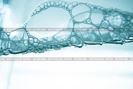 Air bubbles in blue water on white background. Стоковое фото, агентство Ingram Publishing / Фотобанк Лори