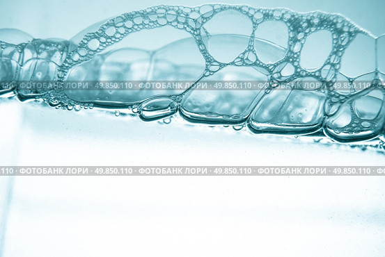 Air bubbles in blue water on white background. Стоковое фото, агентство Ingram Publishing / Фотобанк Лори