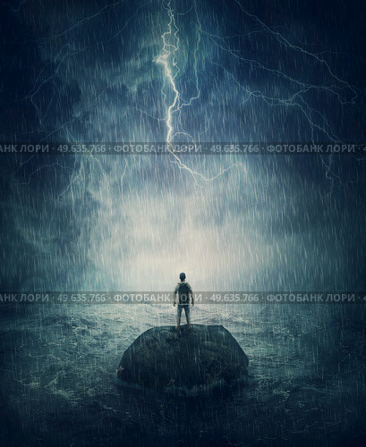 Alone man stands on a small rock island, lost in the middle of the ocean under the stormy night sky. Failure and despair concept, seeking for help. Life crisis, surviving a hopeless situation. Стоковое фото, агентство Ingram Publishing / Фотобанк Лори