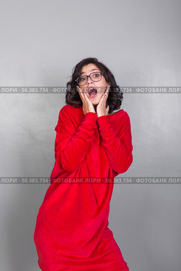 amazed woman red dress. Стоковое фото, агентство Ingram Publishing / Фотобанк Лори