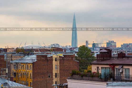 Amazing roof view of old buildings and a modern skyscraper. The tallest building in Europe. City skyline of Saint Petersburg, Russia. Стоковое фото, фотограф Андрей Степанов / Фотобанк Лори