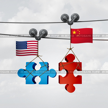 American and Chinese cooperation success as two pieces of a jigsaw puzzle fron the United States and China coming together to unite as a global teamwork metaphor for international agreement and mutual understanding. Стоковое фото, агентство Ingram Publishing / Фотобанк Лори