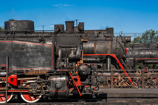 An old Soviet steam locomotive of the L series. The Ruskeala Express retro train is at the Sortavala station. Russia, Republic of Karelia, Sortavala, August 12, 2025. Редакционное фото, фотограф Photojuli / Фотобанк Лори