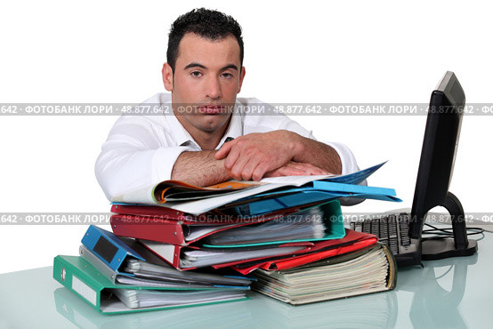 An overworked office worker. Стоковое фото, агентство Ingram Publishing / Фотобанк Лори