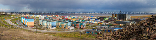 Anadyr, Chukotka, Russia. Wide panorama of a northern city located in the Arctic. Top view of colorful residential buildings and combined heat and power plant. Panoramic photography. Стоковое фото, фотограф Андрей Степанов / Фотобанк Лори