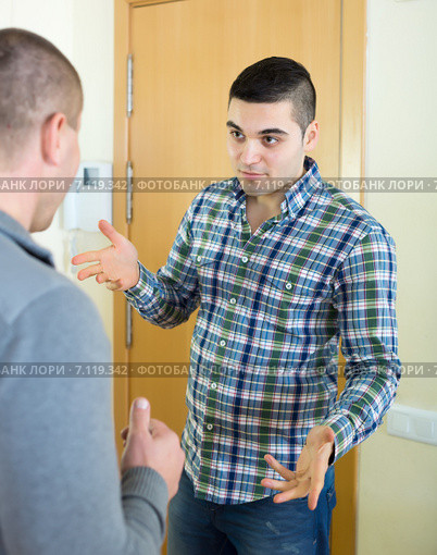 angry men looking at each other with clenching fists. Стоковое фото, фотограф Яков Филимонов / Фотобанк Лори