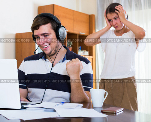 Angry spouse and person with internet addiction. Стоковое фото, фотограф Яков Филимонов / Фотобанк Лори