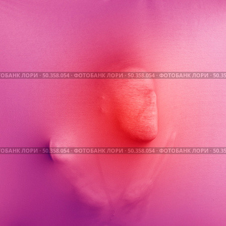 anonymous male pressing pink cloth. Стоковое фото, агентство Ingram Publishing / Фотобанк Лори