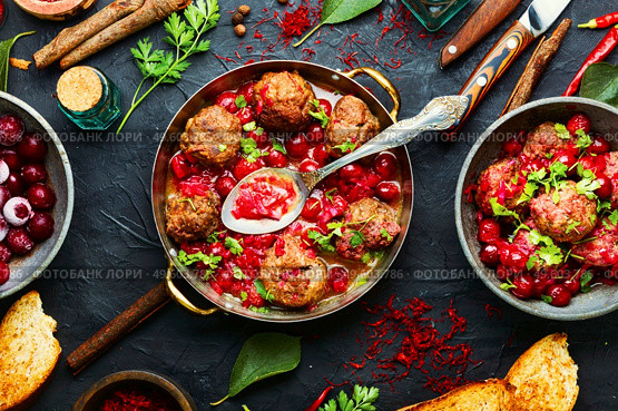 Arabic food lamb kufta spiced with saffron.Appetizing lamb meatballs. Kufta in cherry sauce. Стоковое фото, агентство Ingram Publishing / Фотобанк Лори