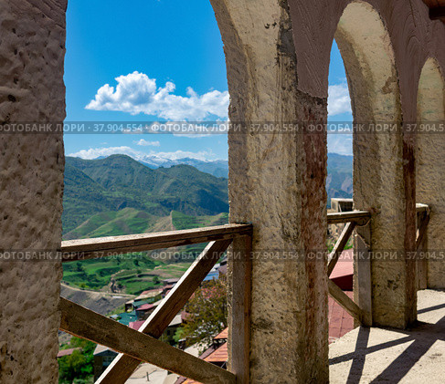 Arched gallery along the facade of the house in the ancient mountain village of Chokh in Dagestan. Стоковое фото, фотограф Евгений Харитонов / Фотобанк Лори