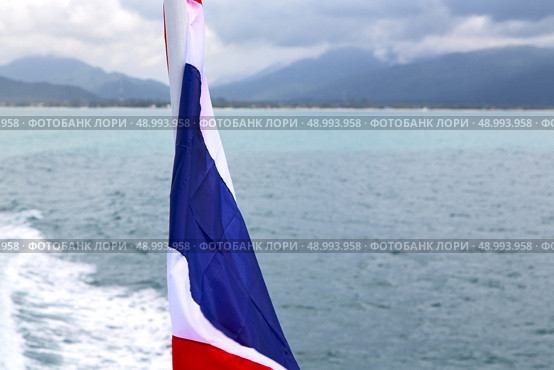 asia myanmar kho samui bay isle waving flag    in thailand and south china sea . Стоковое фото, агентство Ingram Publishing / Фотобанк Лори