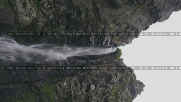 Awesome falls with a stream of cool, refreshing water on a cloudy day (2024 год). Редакционное видео, видеограф Strunov David / Фотобанк Лори
