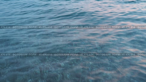 Azure Adriatic Mediterranean Sea. Blue water surface. Travel, boat trips, summer holidays, tourism Montenegro, Bar region. Calm bottomless sea. Travel beach holidays. Aqua ripples. Water background. Стоковое видео, видеограф Юлия Петровская / Фотобанк Лори