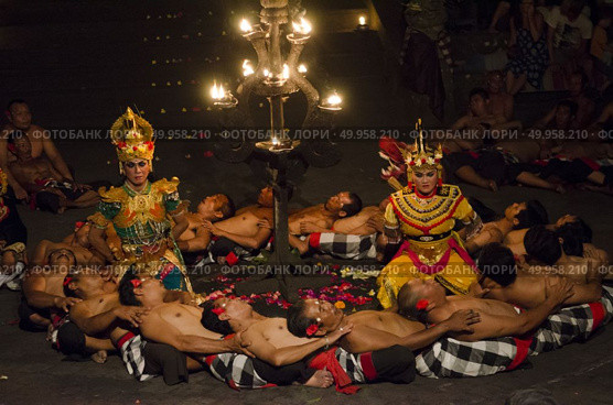 BALI, INDONESIA - JUNE 15: Presentation of traditional balinese Women Kecak Fire Dance on JUNE 15, 2015 on Bali. Kecak (also known as Ramayana Monkey Chant) is very popular cultural show on Bali. Редакционное фото, агентство Ingram Publishing / Фотобанк Лори