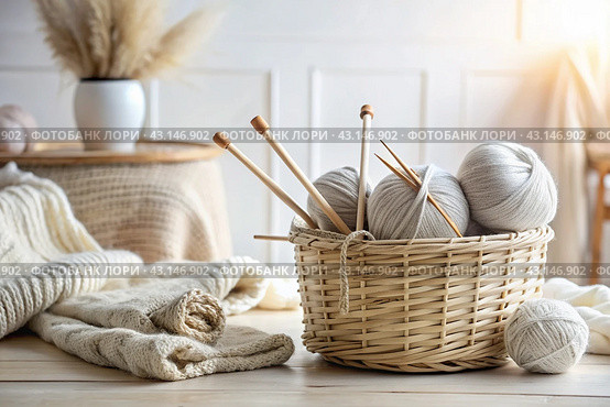 Balls of yarn in a wicker basket in white and beige tones. Needlework, textiles, knitting. Winter season, small business, handmade clothes. Стоковое AI-изображение, AI-художник Photojuli / Фотобанк Лори