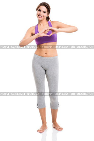 Beautiful and healthy woman making a hearth with her hands, isolated over white background. Стоковое фото, агентство Ingram Publishing / Фотобанк Лори