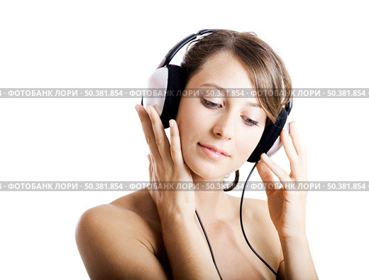 Beautiful young woman listen music with headphones, isolated on white. Стоковое фото, агентство Ingram Publishing / Фотобанк Лори