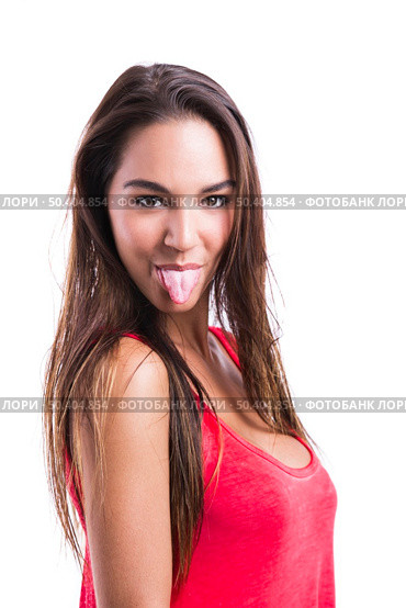 Beautiful young woman making  a grimace with her tongue off, isolated over a white background. Стоковое фото, агентство Ingram Publishing / Фотобанк Лори