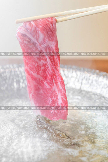 Beef Wagyu A5 Shabu shabu with steam, Groumet Japanese hot pot cuisine. Стоковое фото, агентство Ingram Publishing / Фотобанк Лори