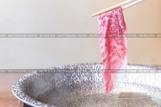 Beef Wagyu A5 Shabu shabu with steam, Groumet Japanese hot pot cuisine. Стоковое фото, агентство Ingram Publishing / Фотобанк Лори