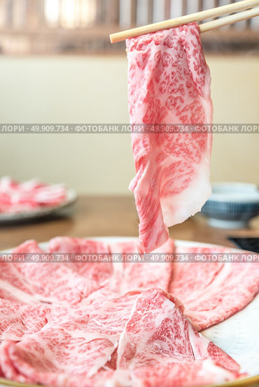 Beef Wagyu A5 Shabu shabu with steam, Groumet Japanese hot pot cuisine. Стоковое фото, агентство Ingram Publishing / Фотобанк Лори
