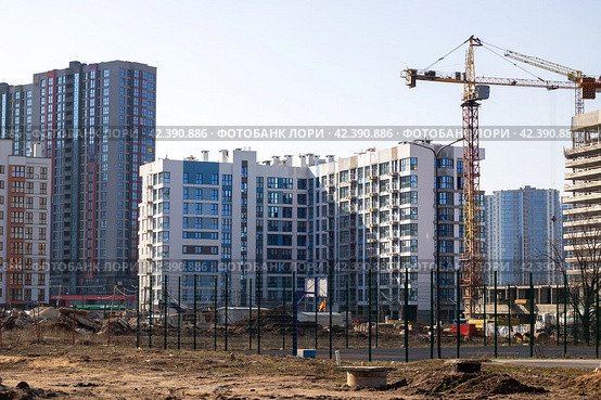 Belarus, Minsk - 07 february, 2024: Modern houses in Minsk world. Редакционное фото, фотограф Аксенова Вера / Фотобанк Лори