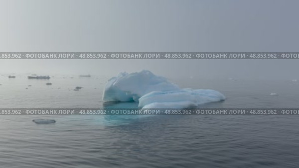 Big Iceberg in Antarctica Winter Scenery, Amazing Shape Ice Formation of Massive Large Enormous Blue Icebergs in Antarctic Peninsula Landscape Seascape with Ocean Sea Water. Стоковое видео, видеограф Vladimir / Фотобанк Лори