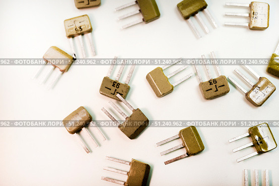 Bipolar transistors on a white background. Semiconductor devices. Microelectronics. Стоковое фото, фотограф Valeriy Lushchikov / Фотобанк Лори