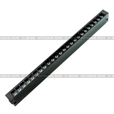 Black linear LED light bar with multiple visible diodes for modern interior lighting and showroom ceiling installation. Стоковое фото, фотограф Татьяна Терехина / Фотобанк Лори