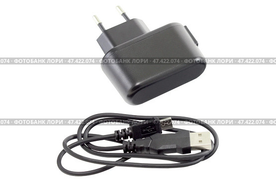 Блок питания на белом фоне. AC/DC adapter  on white background. Стоковое фото, фотограф Татьяна Д / Фотобанк Лори