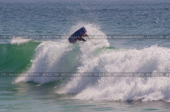 Body boarder riding a big wave. Стоковое фото, агентство Ingram Publishing / Фотобанк Лори