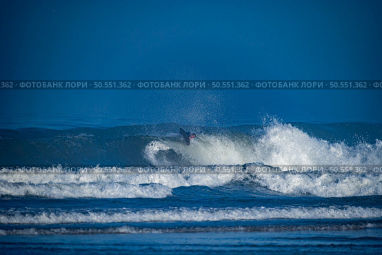 Bodyboarder surfing ocean wave on a sunny winter day. Стоковое фото, агентство Ingram Publishing / Фотобанк Лори