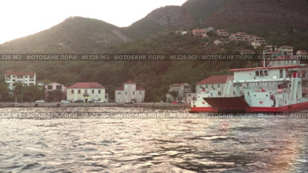 Boka Kotor Adriatic Sea, Verige Strait Kamenari Lepetane Ferry Line Trajekt. Ferryboat for passenger, cargo and vehicles. Tourism and business in Montenegro. Maritime transport coastal. August 16 2022. Стоковое видео, видеограф Юлия Петровская / Фотобанк Лори