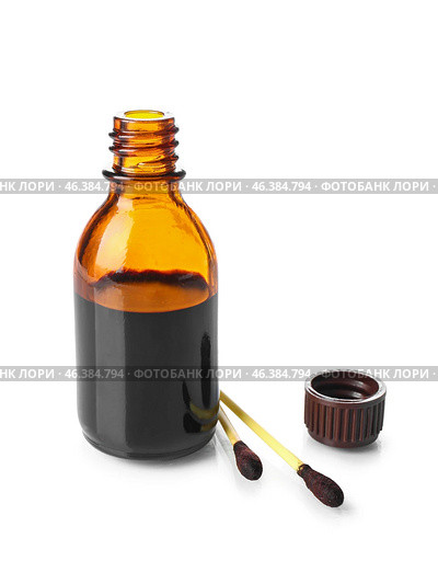 Bottle and cotton swabs with iodine on white background. Стоковое фото, фотограф Pixel_shot / Фотобанк Лори