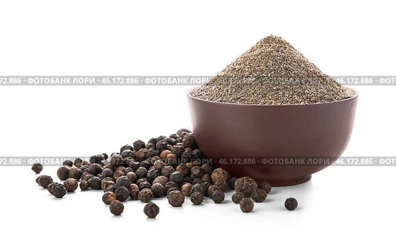 Bowl with black pepper powder on white background. Стоковое фото, фотограф Pixel_shot / Фотобанк Лори