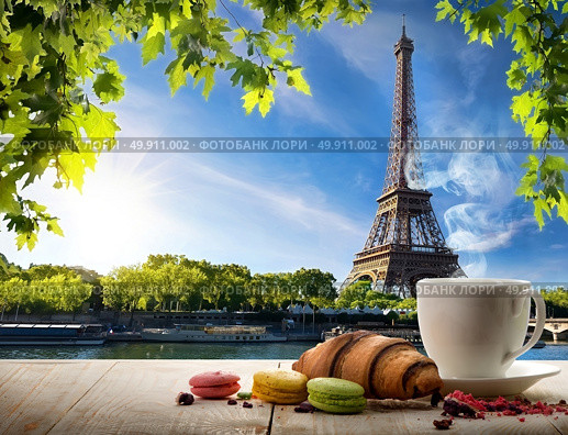 Breakfast with bakery and coffee on table near Eiffel Tower in Paris, France. Стоковое фото, агентство Ingram Publishing / Фотобанк Лори