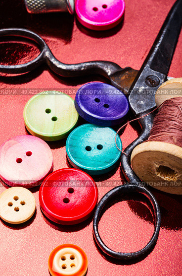 Bright assorted sewing buttons in mix colors. Multicolored decorative buttons. Стоковое фото, агентство Ingram Publishing / Фотобанк Лори
