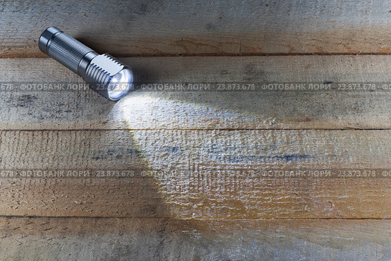 Bright LED flashlight shines. Стоковое фото, фотограф Alexander / Фотобанк Лори