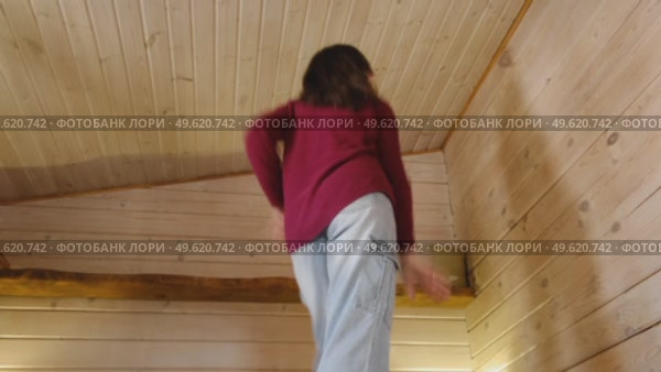 Brunette woman dance, have fun at home listens song, moves to music, feels overjoyed, celebrate good news, relish carefree life looks happy. Young adult female twirls, grooves. Lady dancing in kitchen. Стоковое видео, видеограф Марина Демидюк / Фотобанк Лори
