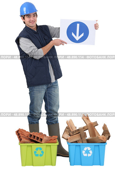 Builder stood with recyclable waste. Стоковое фото, агентство Ingram Publishing / Фотобанк Лори