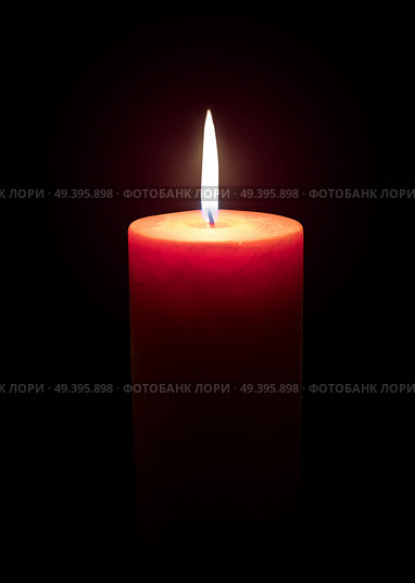 Burning candle isolated on black. Стоковое фото, агентство Ingram Publishing / Фотобанк Лори