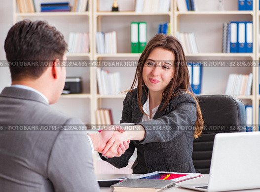 Business meeting between businessman and businesswoman. Стоковое фото, фотограф Elnur / Фотобанк Лори