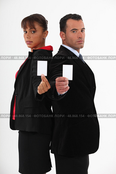 Business-partners offering cards. Стоковое фото, агентство Ingram Publishing / Фотобанк Лори