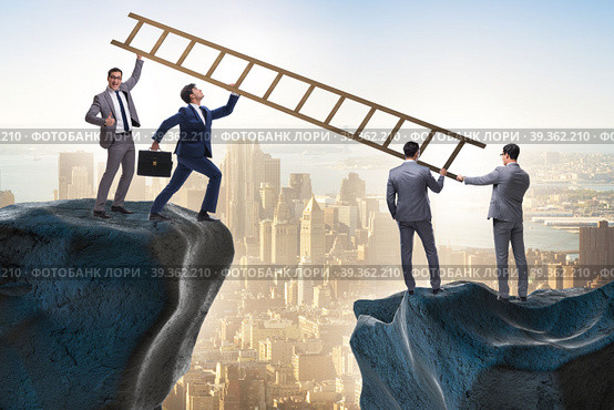 Business people helping to go over chasm. Стоковое фото, фотограф Elnur / Фотобанк Лори