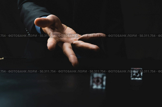 business person hand throw the dice, business gambling game concept. Стоковое фото, агентство Ingram Publishing / Фотобанк Лори